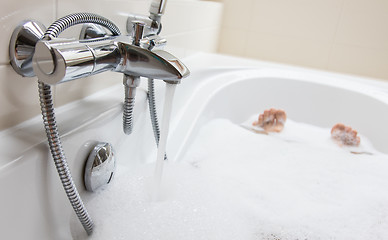 Image showing Men\'s feet in a bathtub, selective focus