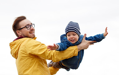 Image showing father with son playing and having fun outdoors