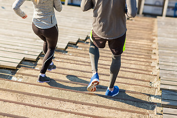 Image showing close up of couple running downstairs on stadium