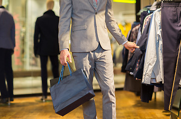 Image showing close up of man with shopping bags at store