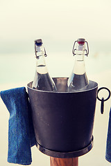 Image showing water bottles in ice bucket at hotel beach