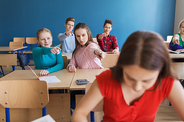 Image showing students gossiping behind classmate back at school