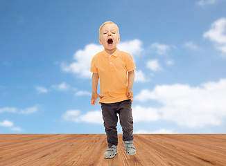 Image showing happy little boy shouting or sneezing