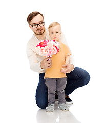 Image showing happy father and son with bunch of flowers