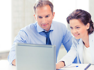 Image showing man and woman working with laptop in office