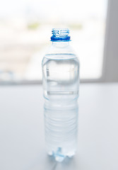 Image showing close up of bottle with drinking water on table