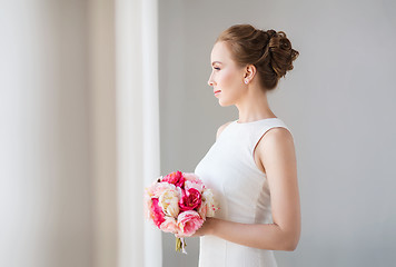 Image showing bride or woman in white dress with flower bunch