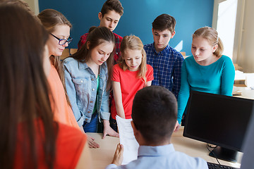 Image showing group of students and teacher with tests at school