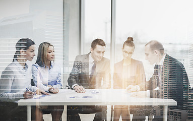 Image showing business team with documents having discussion