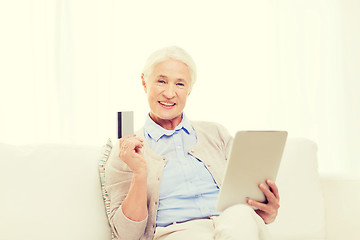 Image showing senior woman with tablet pc and credit card