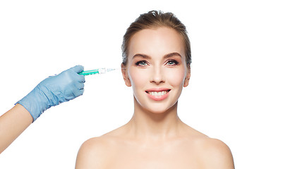 Image showing woman face and hand with syringe making injection