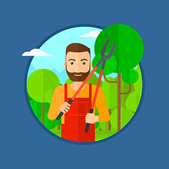 Image showing Farmer with pruner in garden.