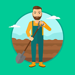 Image showing Farmer on the field with shovel.