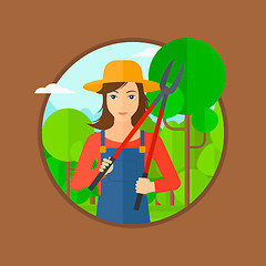 Image showing Farmer with pruner in garden.