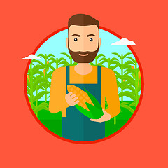 Image showing Farmer holding corn.