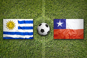 Image showing Uruguay vs. Chile flags on soccer field