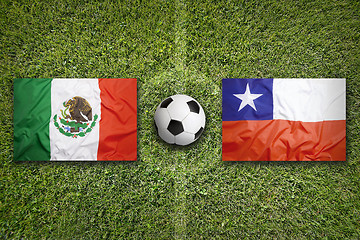 Image showing Mexico vs. Chile flags on soccer field