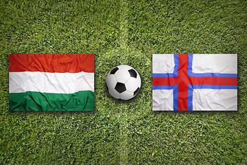 Image showing Hungary vs. Faeroe Islands flags on soccer field