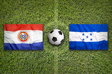 Image showing Paraguay vs. Honduras flags on soccer field