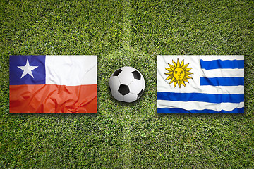 Image showing Chile vs. Uruguay flags on soccer field