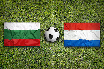 Image showing Bulgaria vs. Netherlands flags on soccer field