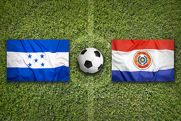 Image showing Honduras vs. Paraguay flags on soccer field