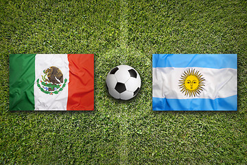 Image showing Mexico vs. Argentina flags on soccer field