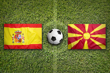 Image showing Spain vs. Macedonia flags on soccer field