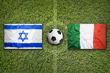 Image showing Israel vs. Italy flags on soccer field