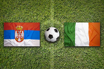 Image showing Serbia vs. Ireland flags on soccer field