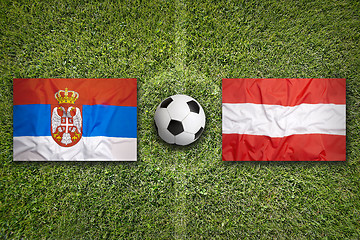 Image showing Serbia vs. Austria flags on soccer field