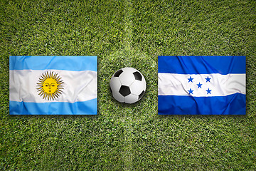 Image showing Brazil vs. Honduras flags on soccer field