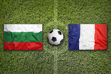 Image showing Bulgaria vs. France flags on soccer field