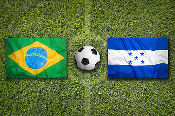 Image showing Brazil vs. Honduras flags on soccer field