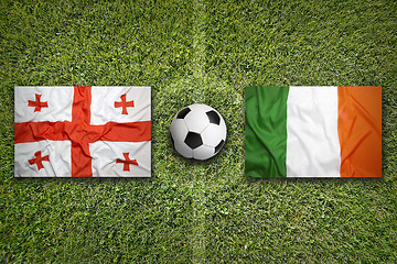 Image showing Georgia vs. Ireland flags on soccer field