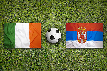 Image showing Ireland vs. Serbia flags on soccer field