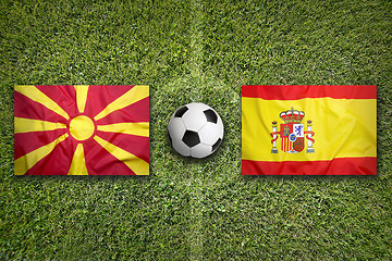 Image showing Macedonia vs. Spain flags on soccer field