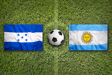 Image showing Honduras vs. Argentina flags on soccer field