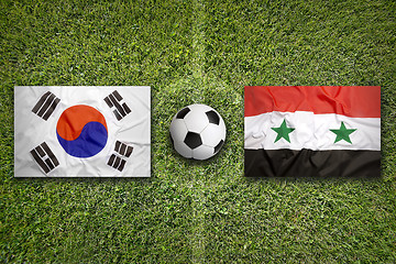 Image showing South Korea vs. Syria flags on soccer field