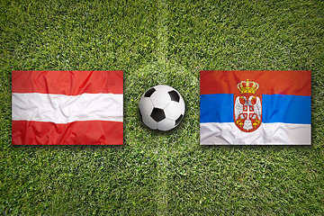 Image showing Austria vs. Serbia flags on soccer field