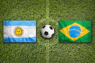 Image showing Argentina vs. Brazil flags on soccer field