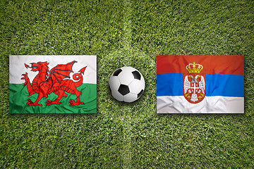 Image showing Wales vs. Serbia flags on soccer field