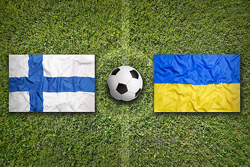 Image showing Finland vs. Ukraine flags on soccer field