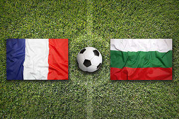 Image showing France vs. Bulgaria flags on soccer field