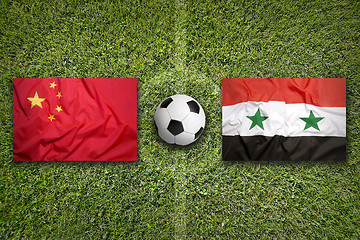 Image showing China vs. Syria flags on soccer field