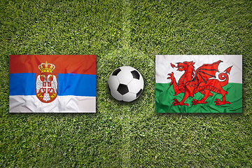 Image showing Serbia vs. Wales flags on soccer field