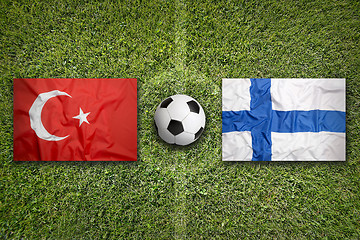 Image showing Turkey vs. Finland flags on soccer field