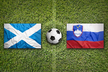 Image showing Scotland vs. Slovenia flags on soccer field