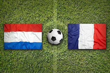 Image showing Netherlands vs. France flags on soccer field