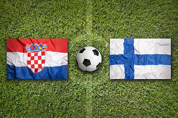 Image showing Croatia vs. Finland flags on soccer field